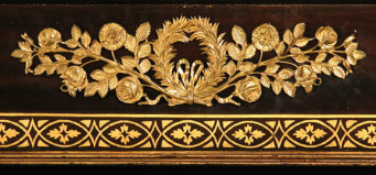 Photograph of an ormolu mount on a pier table.