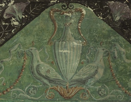 Detail of doves supporting swags of beads on a sample of the Morris-Jumel wallpaper at the Cooper-Hewitt Museum.