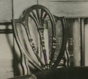 Photograph of a Hepplewhite-style chair in the dining room of the Morris-Jumel Mansion, 1887.
